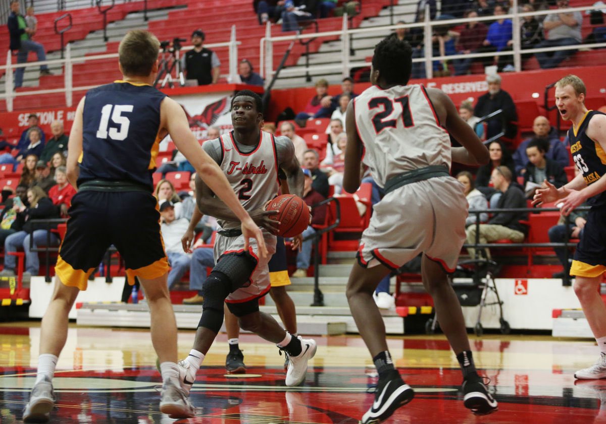 Driving to the basket at Casper College, USA